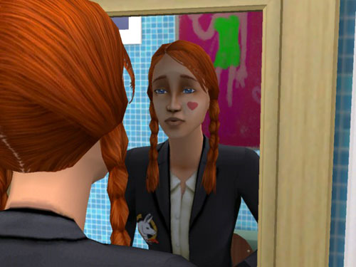 Candice at the mirror admiring the heart on her cheek.