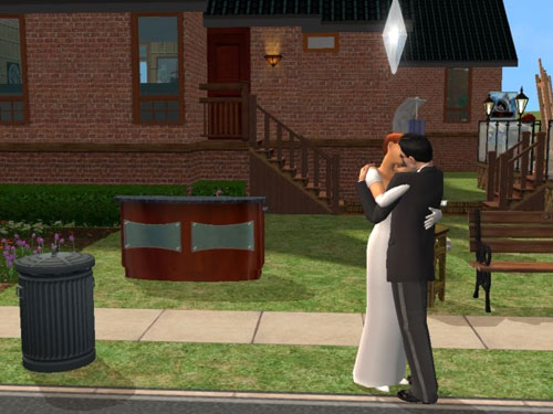 The newlyweds kiss in front of the house