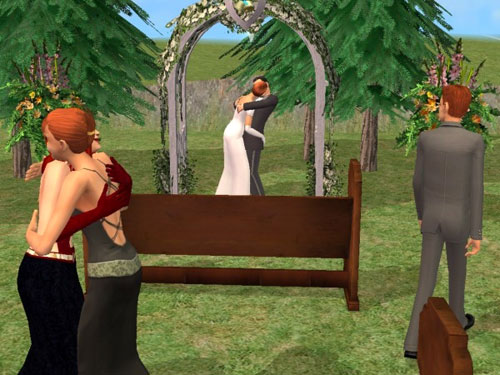 The happy couple make out under the arch