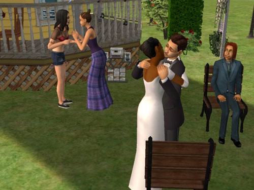 Randy and Regina kiss at the after-wedding party
