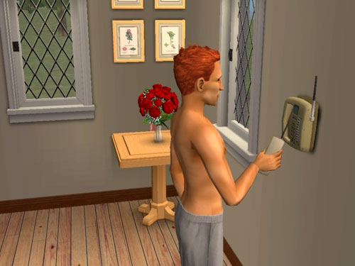 Remington (in just his sweatpants) hangs up the phone Remington (in just his sweatpants) hangs up the phone