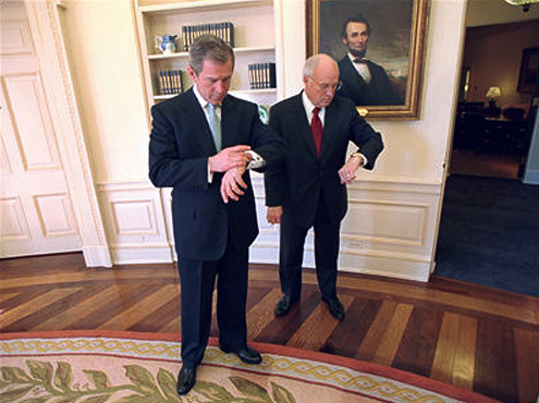 Bush and Cheney look at their watches